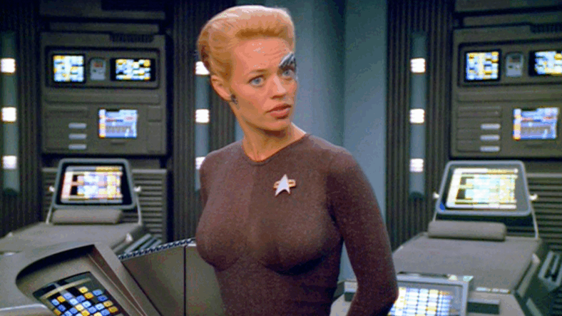 Seven of Nine (Jeri Ryan) agrees to help The Doctor (Robert Picardo) investigate his missing memories in Star Trek: Voyager Season 5 Episode 11 "Latent Image" (1999), Paramount