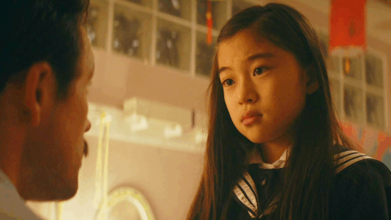 Henk Rogers (Taron Egerton) promises his daughter Maya (Kanon Narumi) that he'll return from Russia soon in Tetris (2023), Apple