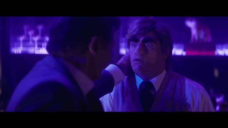 Frank Drebin Jr. (Liam Neeson) punches a bartender (Cody Rhodes) ugly in The Naked Gun (2025), Paramount Pictures