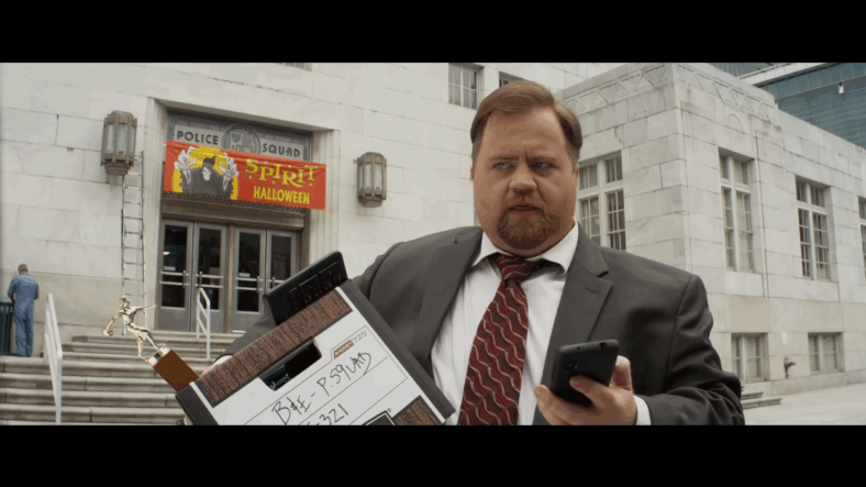 Ed Hocken Jr. (Paul Walter Hauser) leaves Police Squad in The Naked Gun (2025), Paramount Pictures