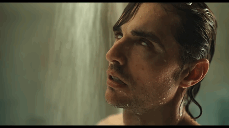 Tim Brassington (Dave Branco) drifts into the unknown while in the shower in Together (2025), Neon