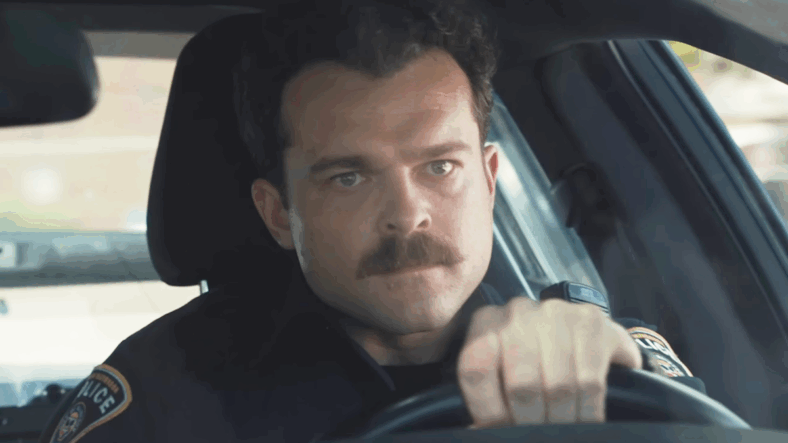 Paul (Alden Ehrenreich) chases down a lead in Weapons (2025), New Line Cinema