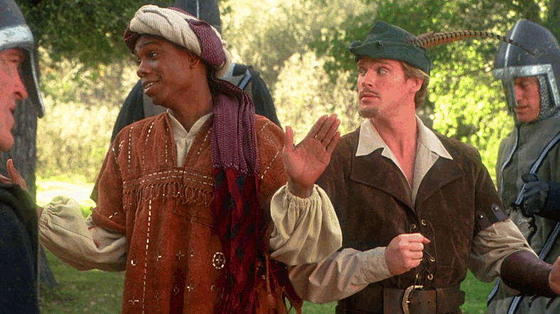 Robin (Cary Elwes) and Achoo (Dave Chappelle) find themselves surrounded by Prince John's (Richard Lewis) men in Robin Hood: Men in Tights (1993), Brooksfilms