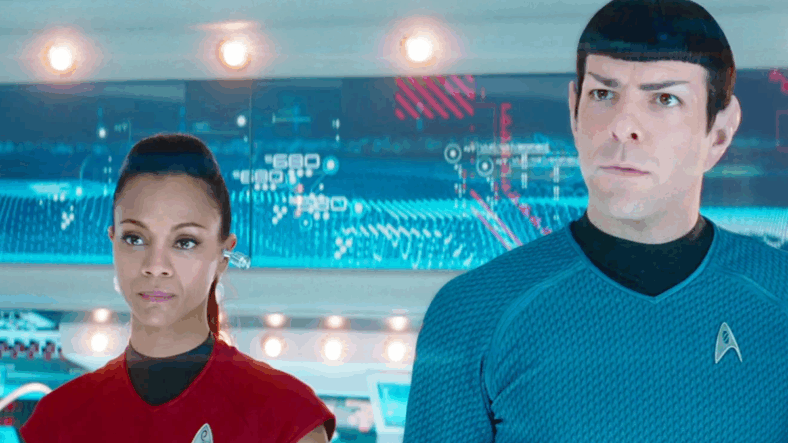 Uhura (Zoe Saldaña) and Spock (Zachary Quinto) receive orders from Kirk (Chris Pine) in Star Trek Into Darkness (2013), Paramount Pictures