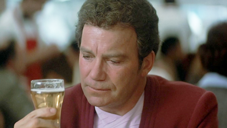 Captain Kirk (William Shatner) is surprised by the taste of the beer of the 20th century in Star Trek IV: The Voyage Home (1986), Paramount Pictures,