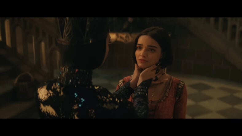 The Evil Queen (Gal Gadot) appraises Snow White's (Rachel Zegler) threat level in Snow White (2025), Disney