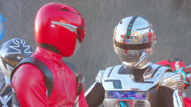 Red Buster (Katsuhiro Suzuki) arrives with his fellow toku heroes to assist Space Sheriff Gavan (Yuma Ishigaki) in Kamen Rider × Super Sentai × Space Sheriff Super Hero Taisen Z (2012), Toei Co. Ltd.