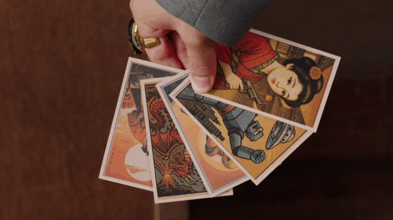 Kinjiro (Jin Matsumoto) believes in the heart of the AI generated menko cards in No. 1 Sentai Gozyuger Episode 35 "Transform!! You Too Can Become Younger" (2025), Toei Co. Ltd.