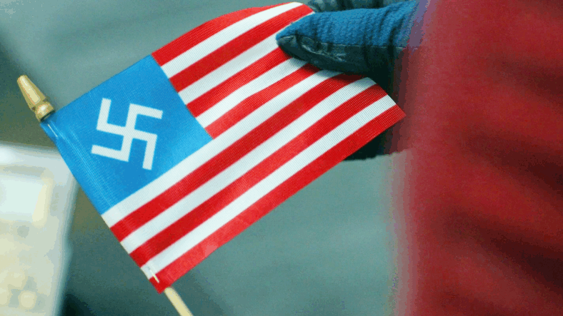 Christopher Smith (John Cena) discovers his new favorite place is actually Earth-X in Peacemaker Season 2 Episode 6 "Ignorance is Chris" (2025), DC Studios