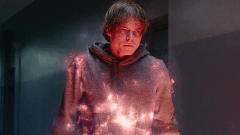 Sam Guthrie (Charlie Heaton) prepares to barrel through a pair of Smiling Men in The New Mutants (2020), Marvel Entertainment