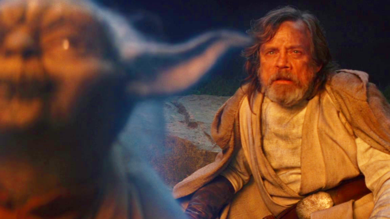 Luke Skywalker (Mark Hamill) watches on as Yoda (Frank Oz) lights up the sacred Jedi texts in Star Wars: Episode VIII - The Last Jedi (2017), Disney